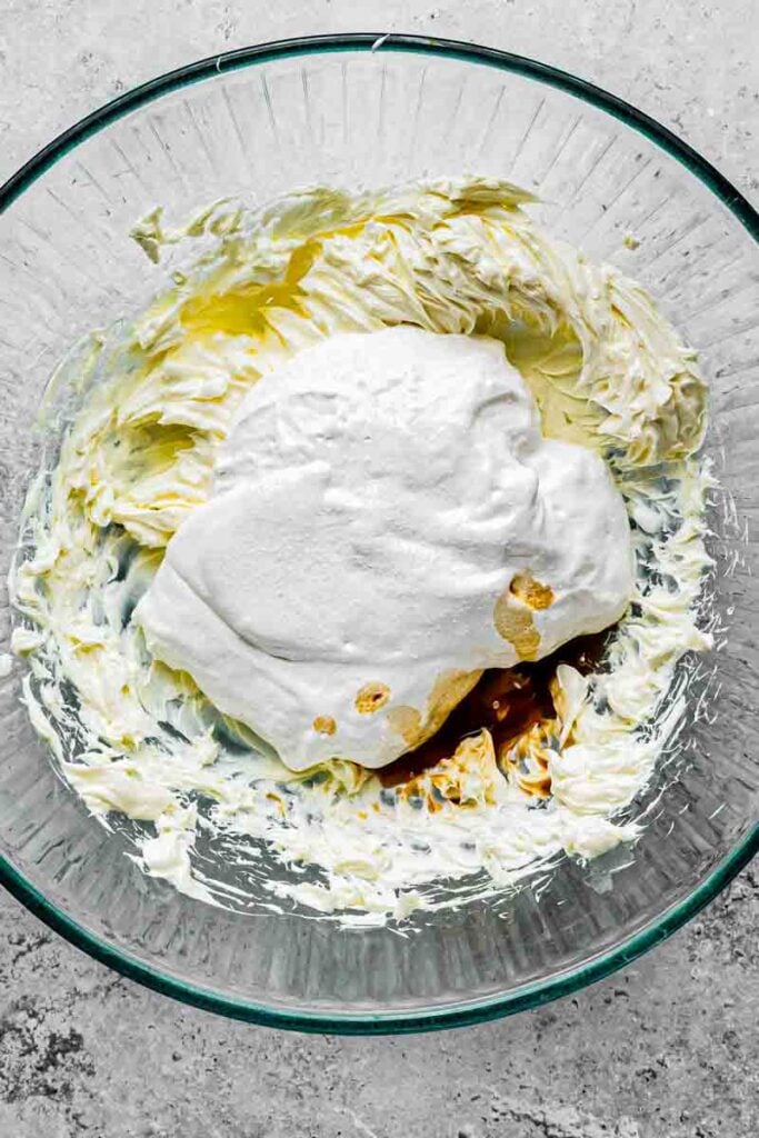 marshmallow fluff, lemon juice, vanilla, almond extract, and salt added to the whipped cream cream cheese