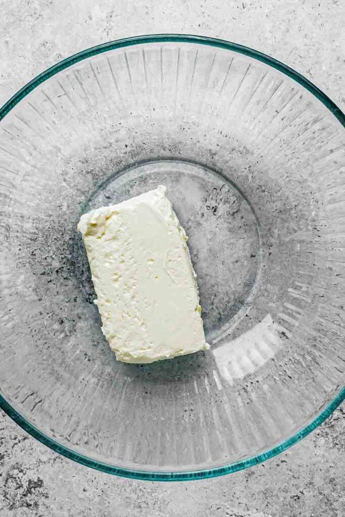 cream cheese block in the bowl before being whipped