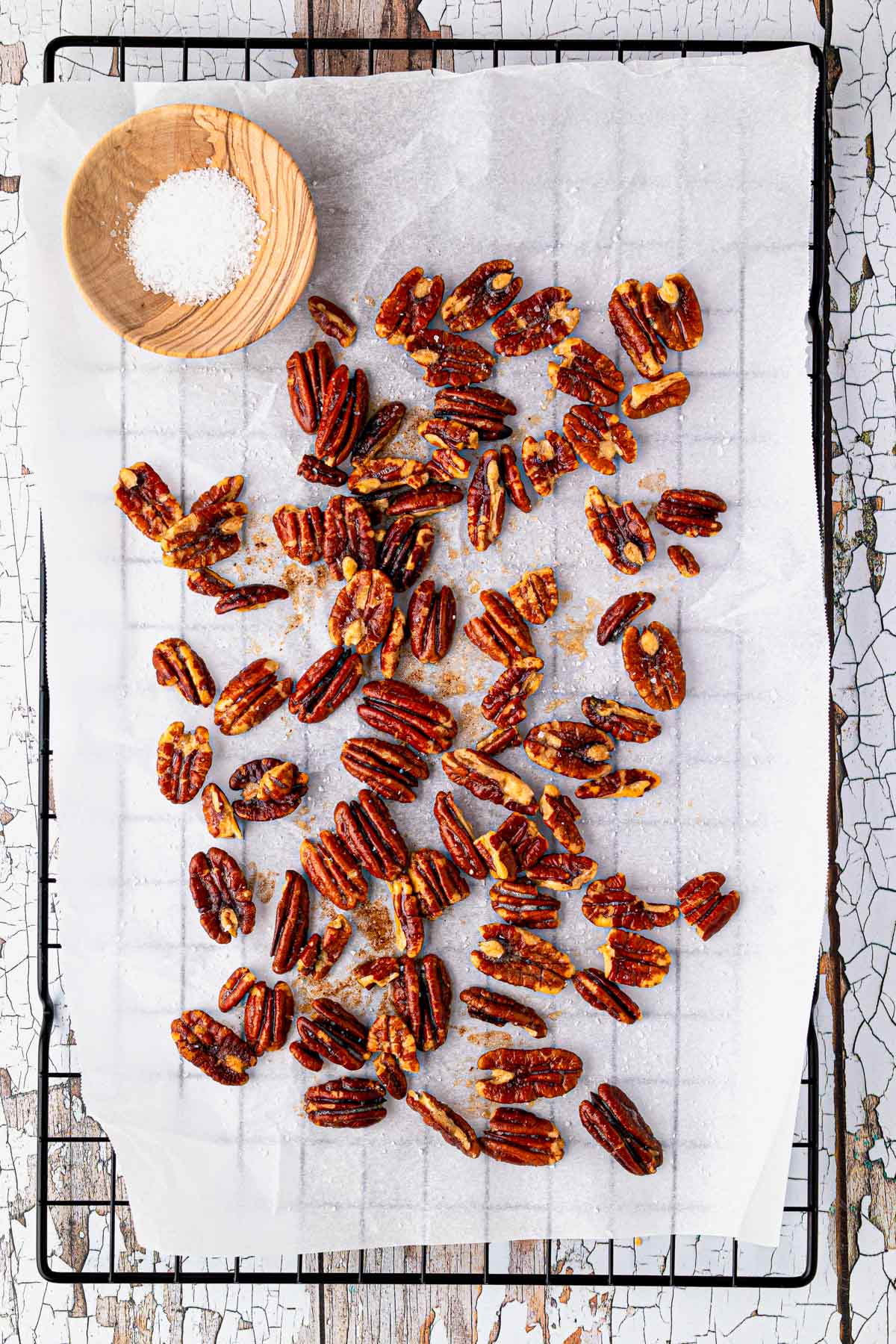 toasted pecans on parchment paper straight from the oven