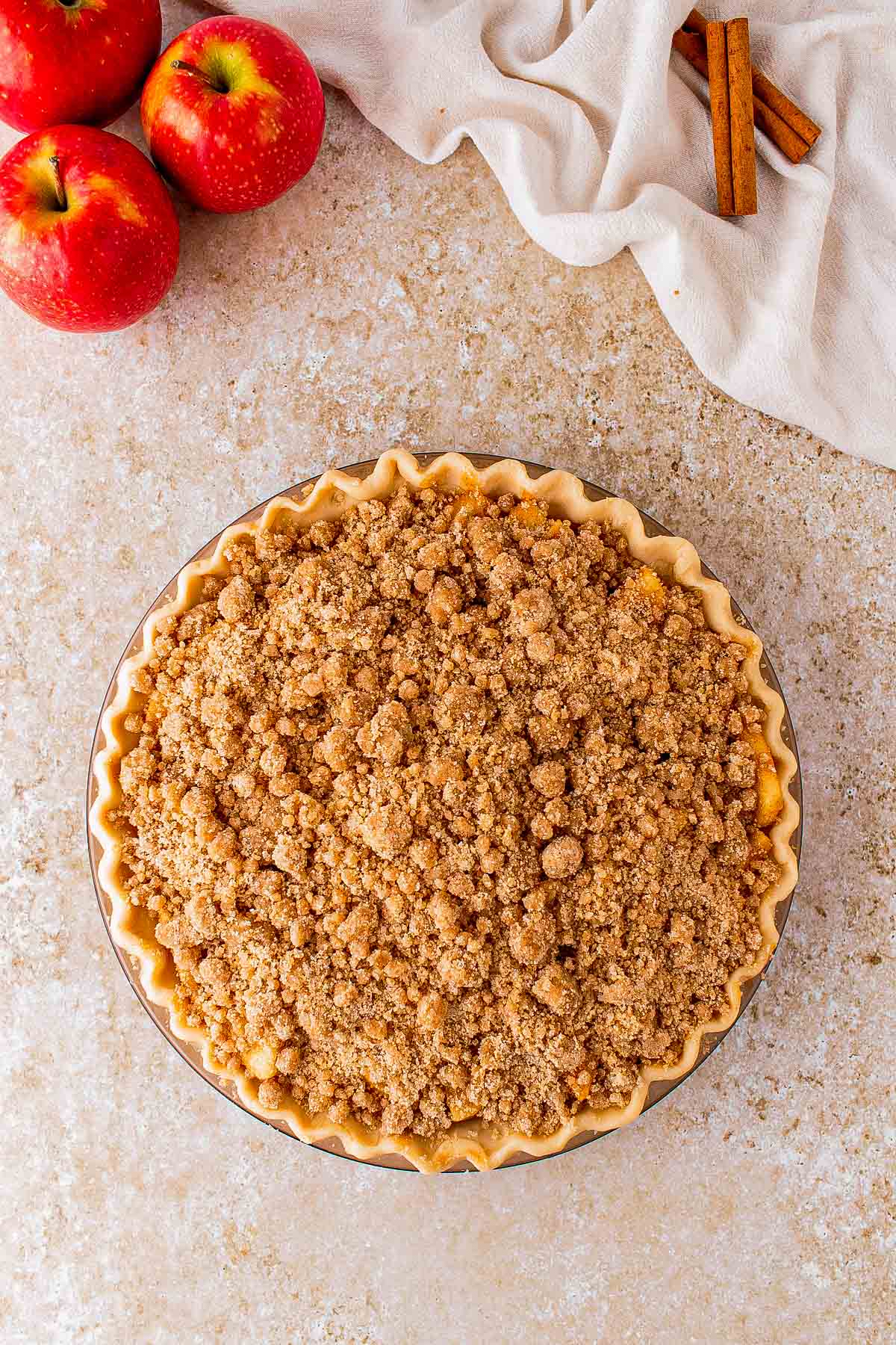Brown sugar crumble scattered over the apple filling.