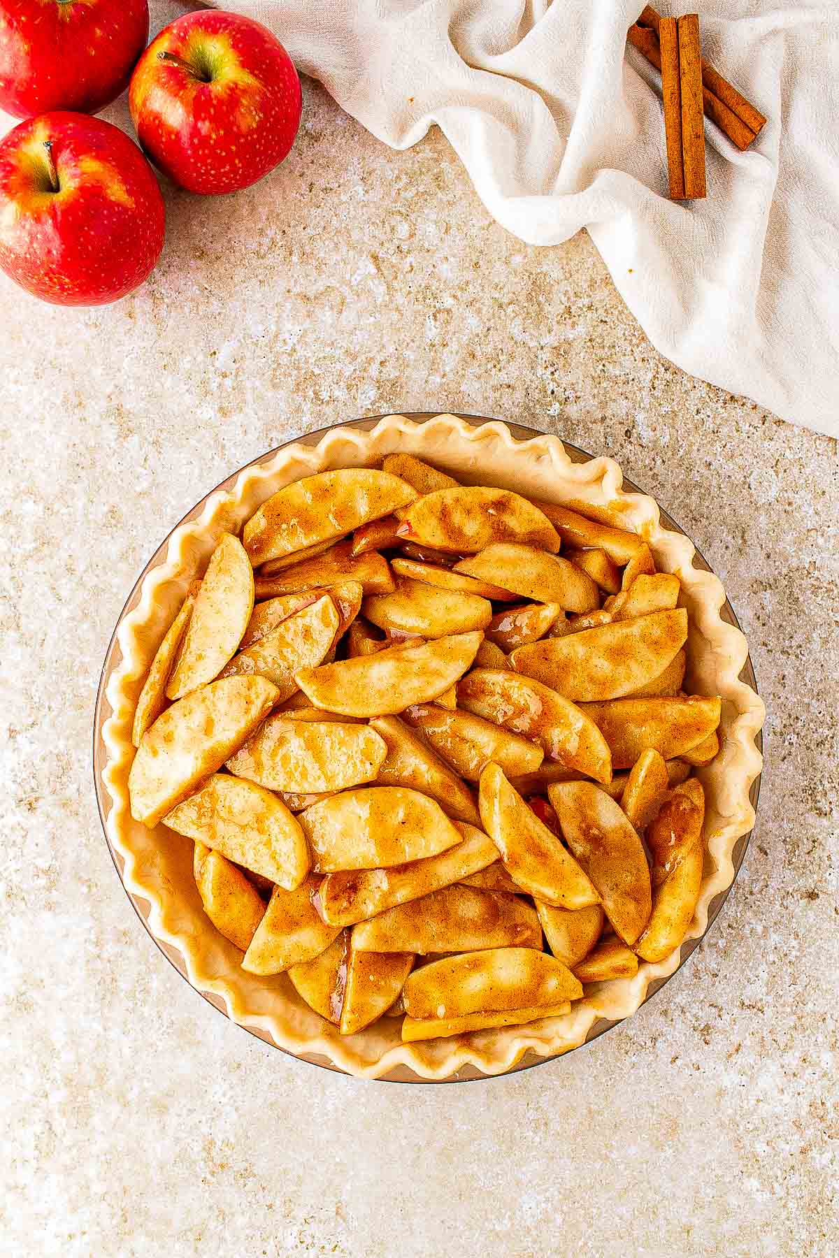 Caramel apple filling arranged in an unbaked pie crust.