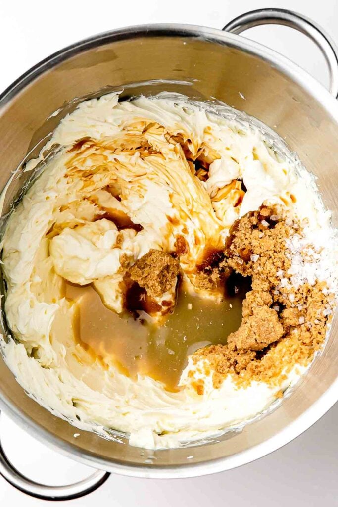 Folding: Folding whipped cream into the brown sugar cream cheese filling with a spatula