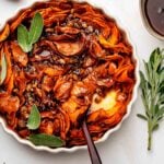 Sliced Sweet Potato Casserole with pecans and maple syrup