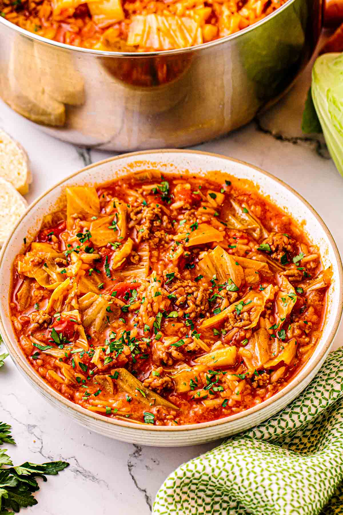 Chopped fresh parsley sprinkled over a pot of cabbage roll soup