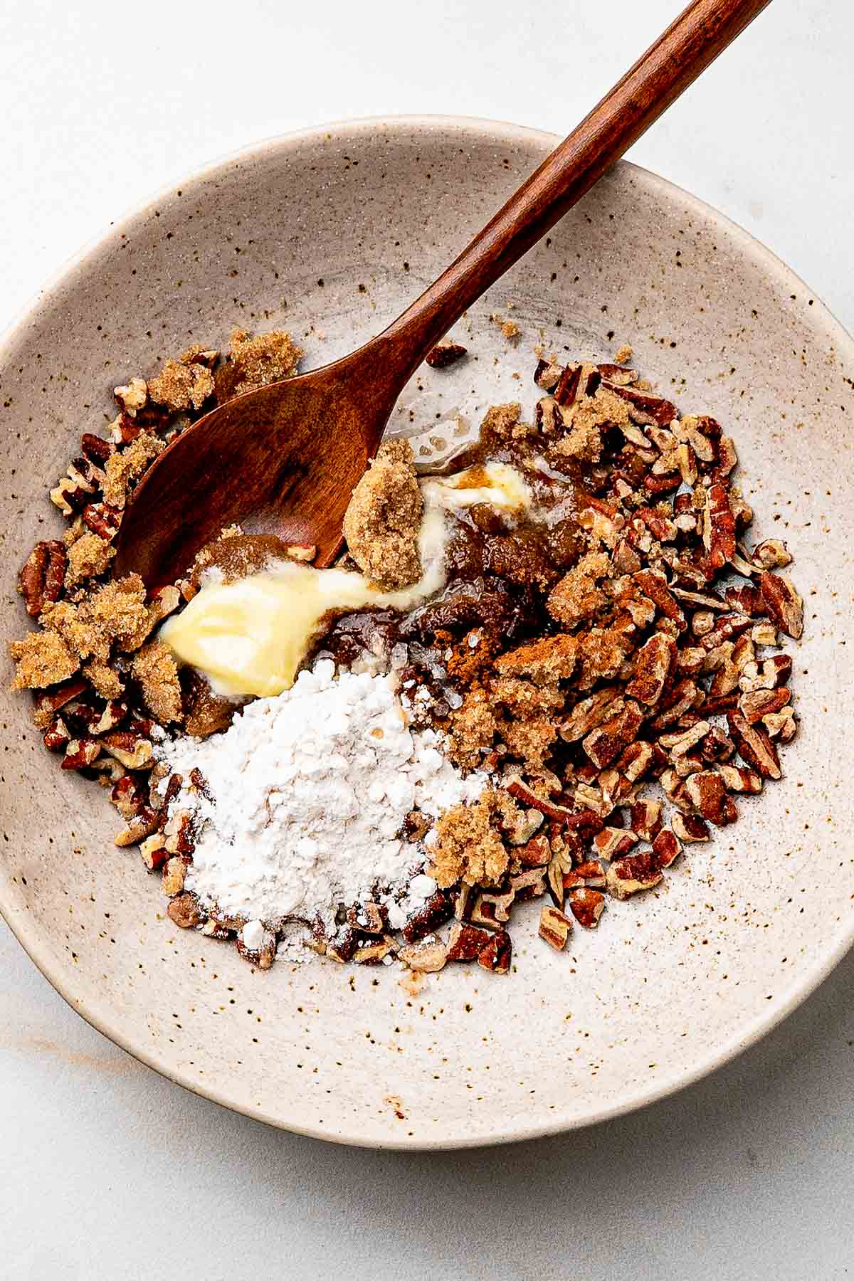 sugar, pecans and salt in the bowl for sweet potato casserole