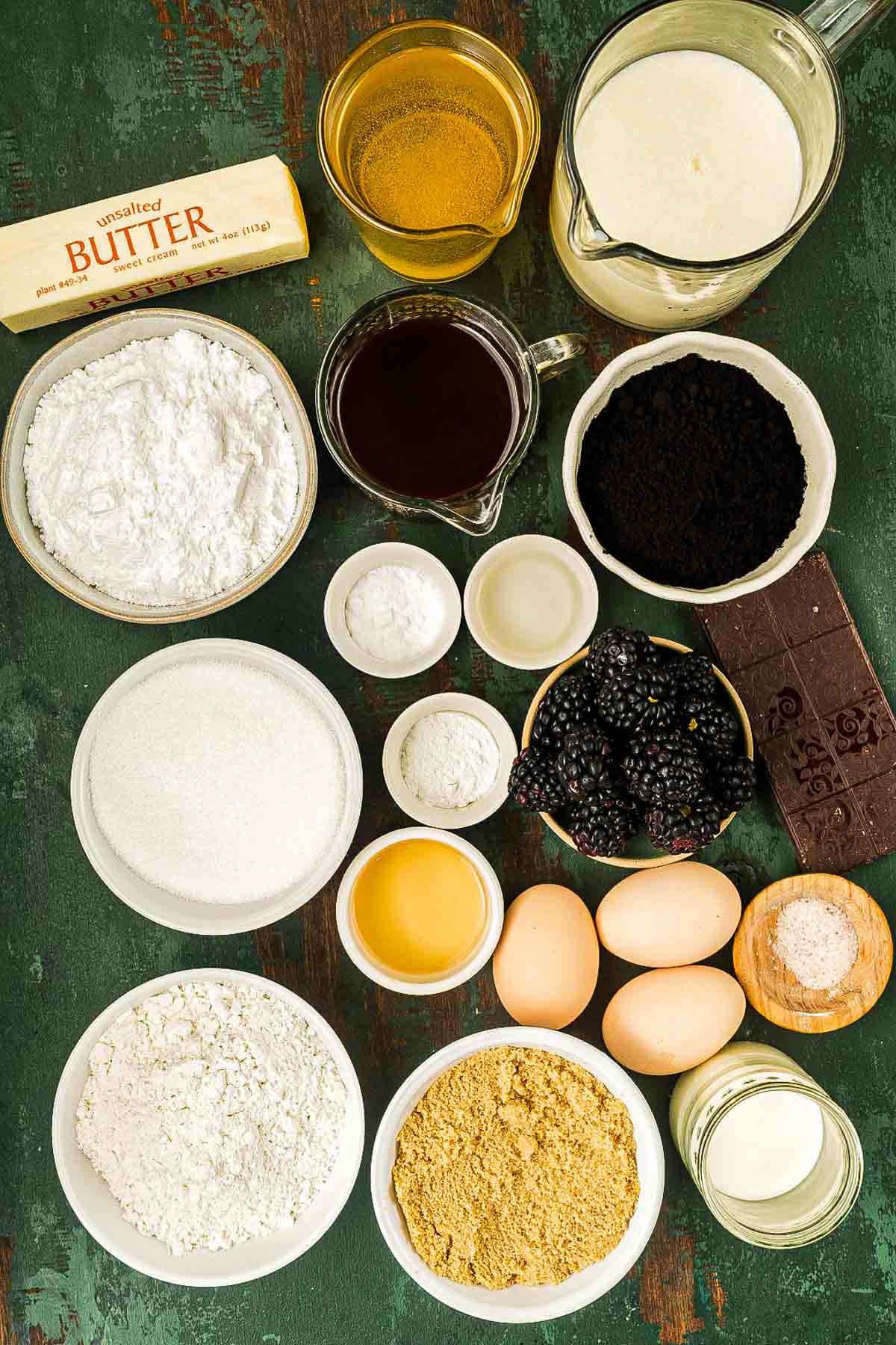 Ingredients for black velvet cake, including black cocoa powder, flour, sugars, buttermilk, oil, eggs, and coffee