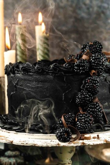 black velvet cake with blackberries wit smoke on Halloween