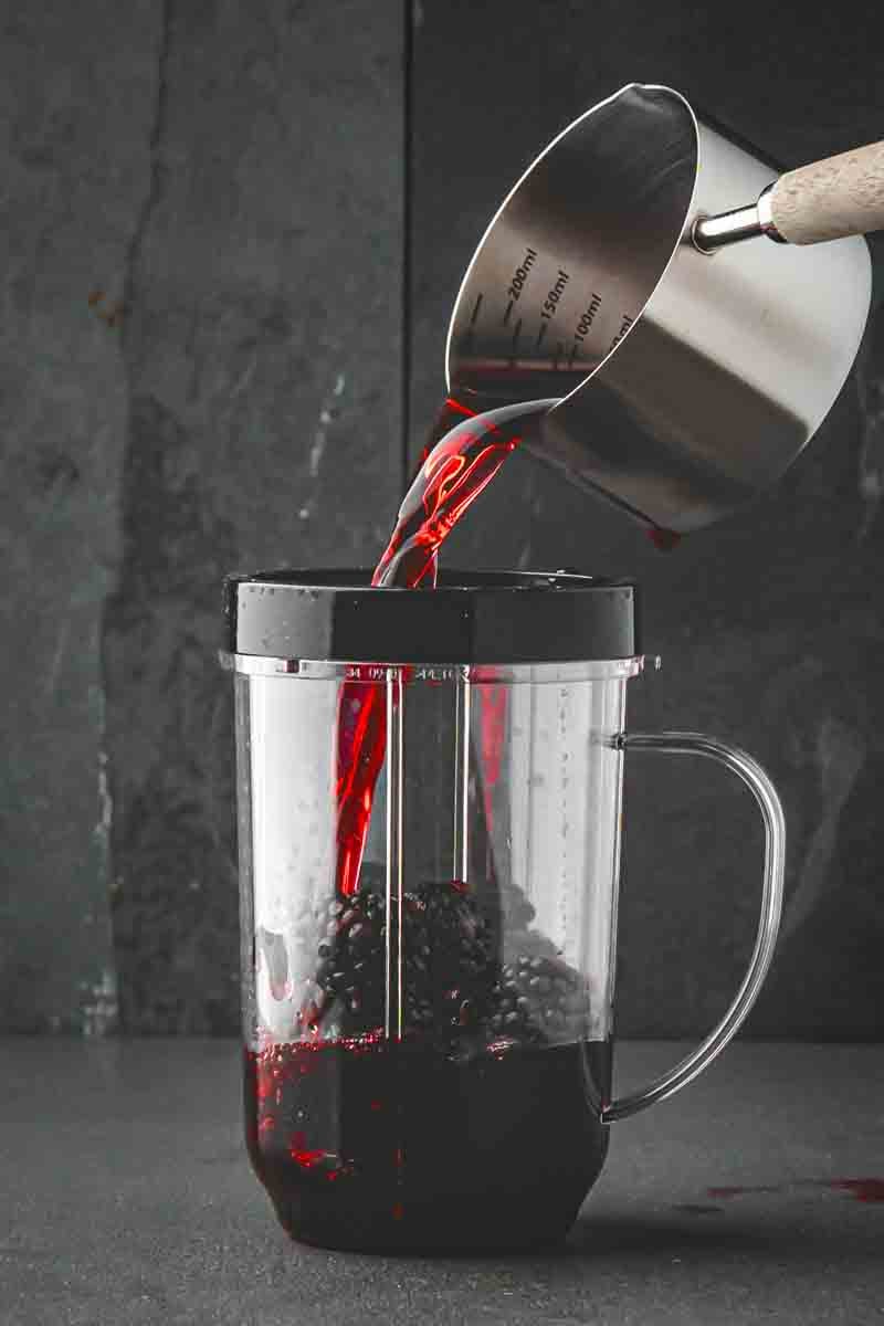 Seedless blackberry grape juice base in a pitcher after straining